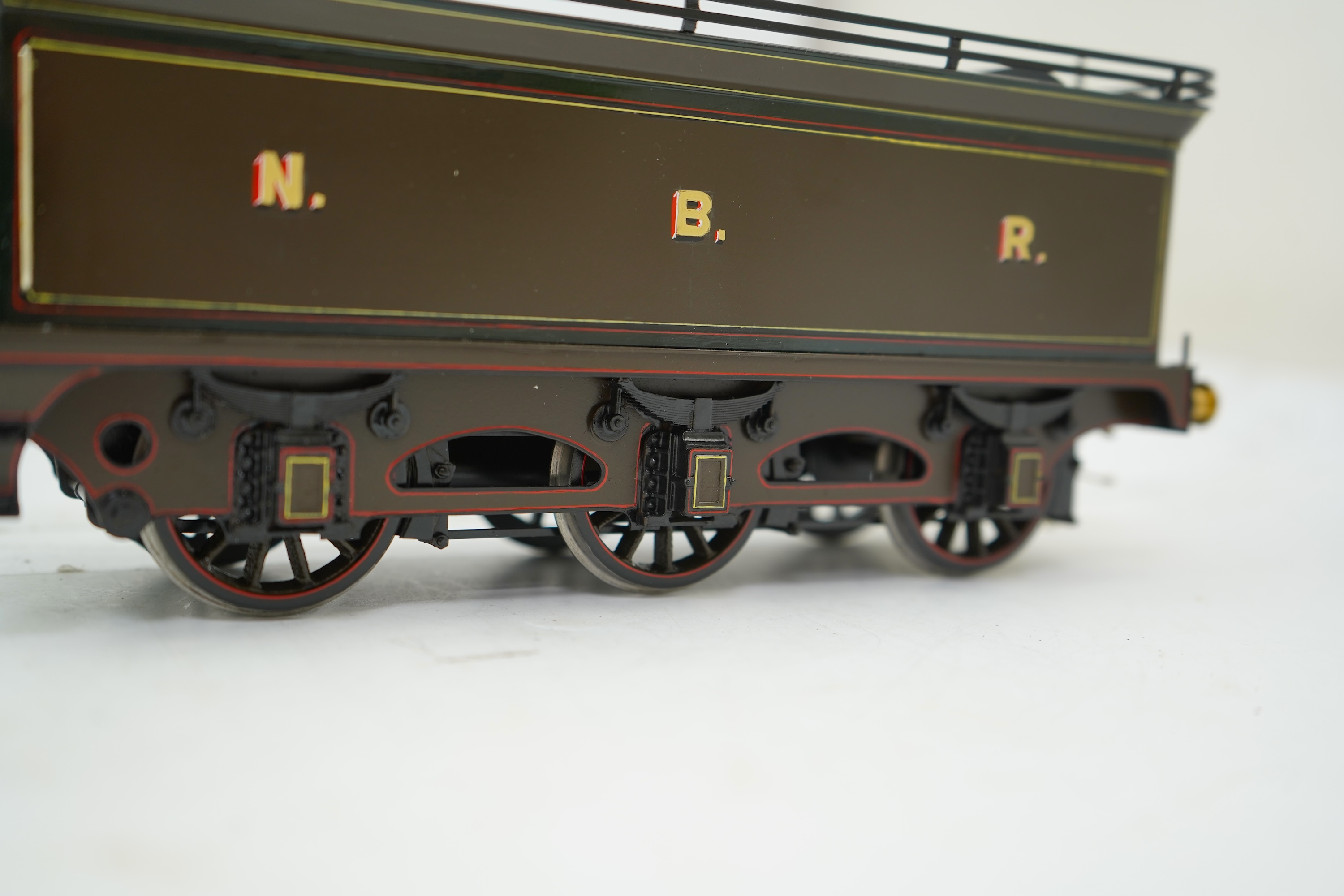A Gauge One model of North British Railways H Class Auld Reekie 872, 4-4-2 Atlantic tender locomotive, the model has been left unpowered to allow for a high level of detailing of the valve gear and cylinders between the